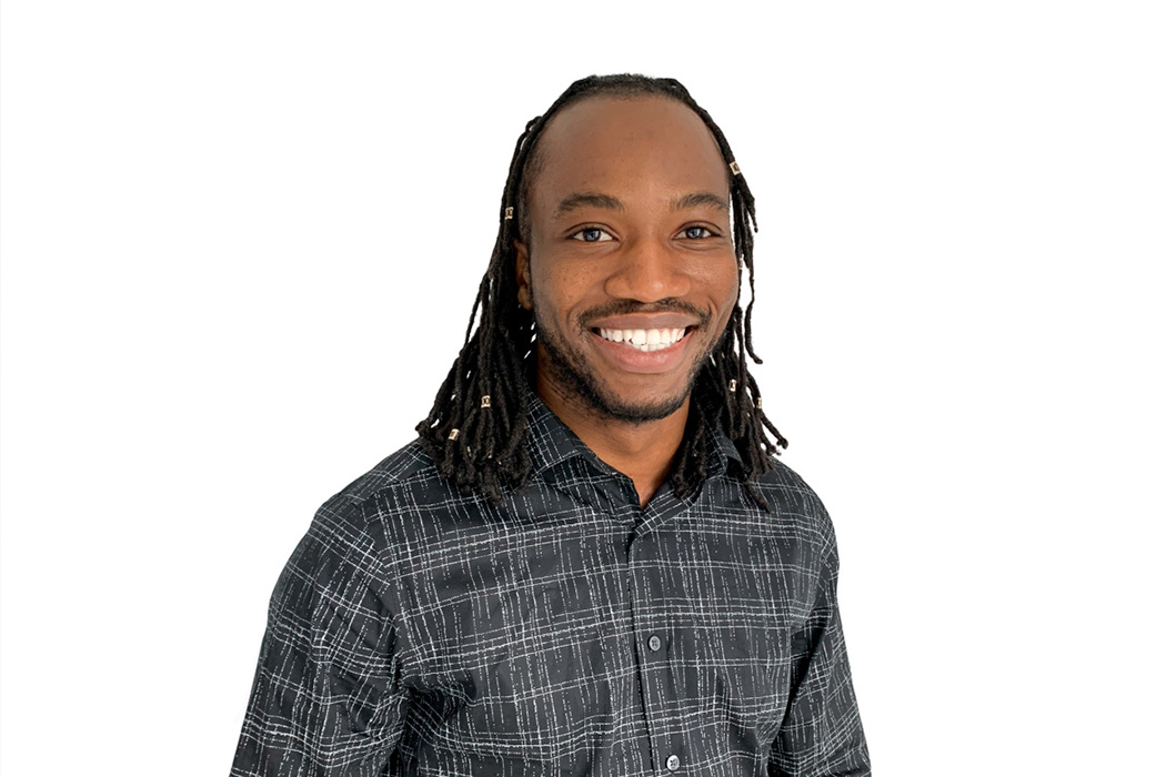 Heroic Headshot on white background of business casual man taking remote virtual headshot.