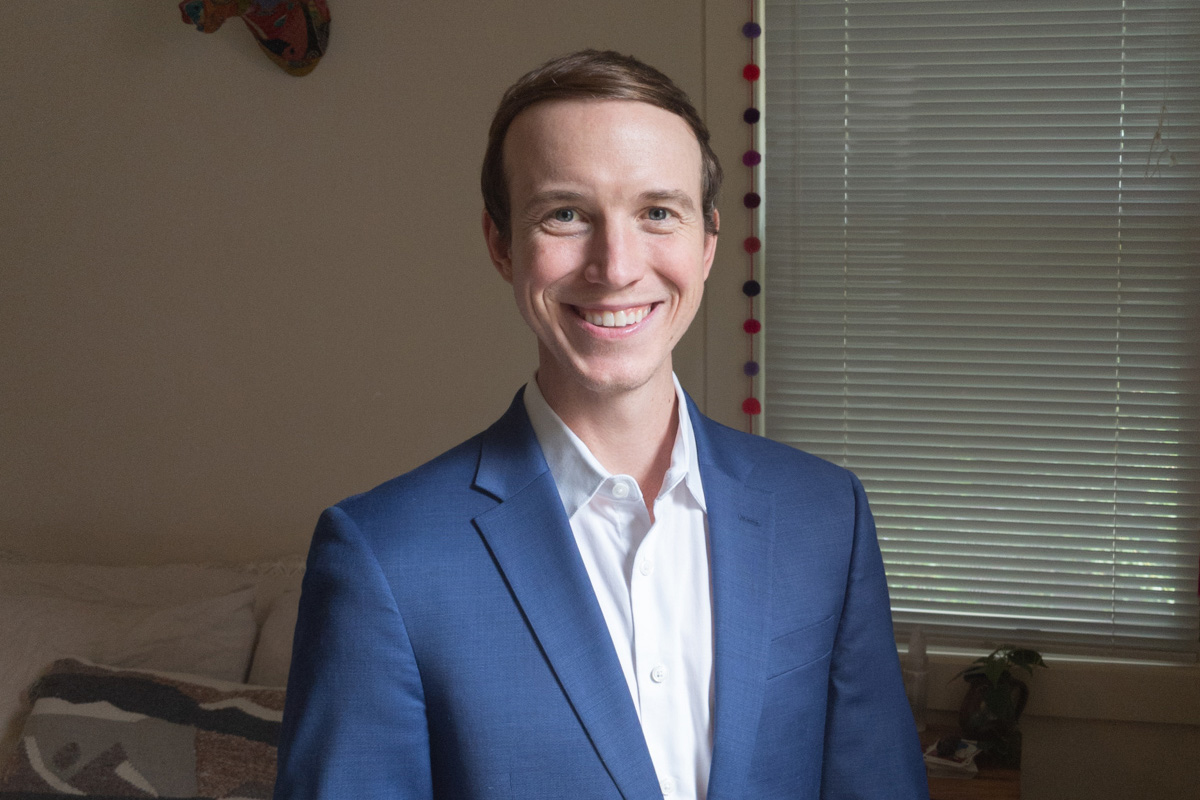 Heroic Headshots business man in suit taking remote virtual headshot from home