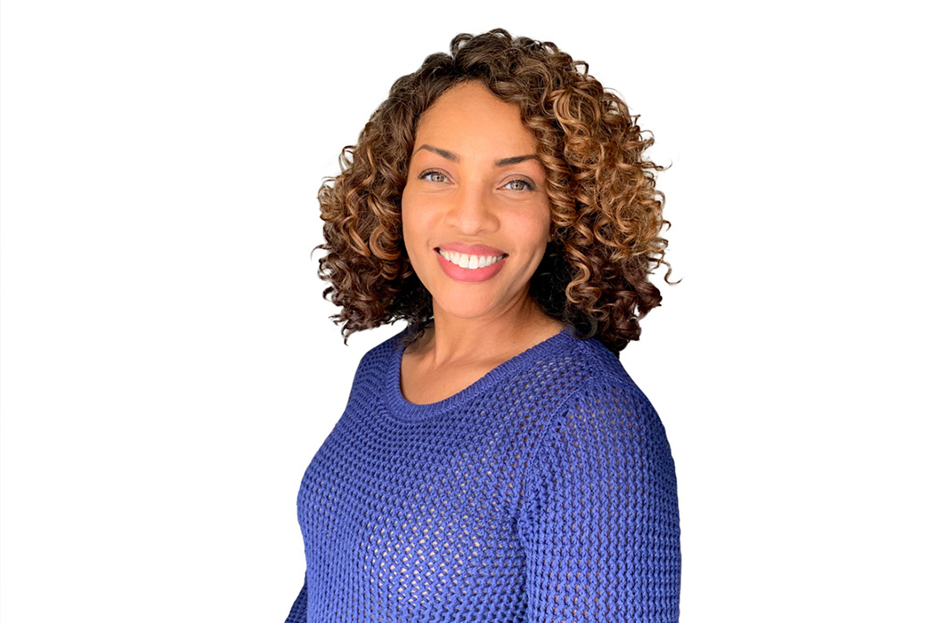 Heroic Headshot on white background of business casual woman taking remote virtual headshot.